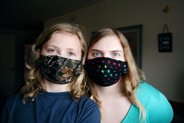 Mother and daughter wearing Covid-19 face masks